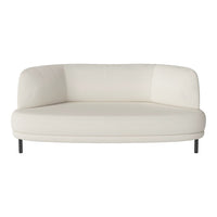 Curved white sofa with a smooth texture and minimalist design, perfect for modern decor.