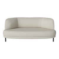 Cream curved sofa with a smooth texture and minimalist design, featuring a neutral color palette and subtle patterns.