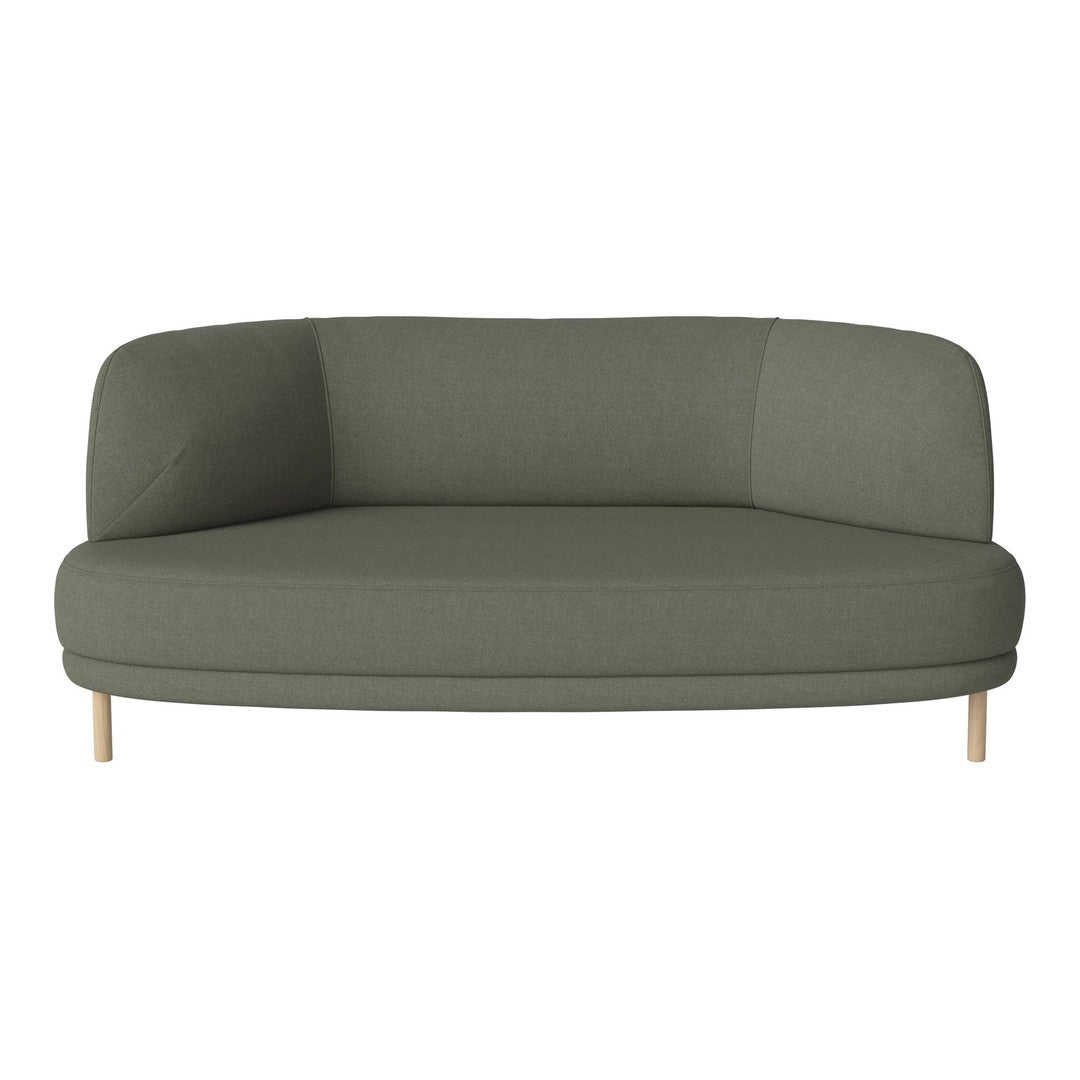 Green upholstered sofa with a modern curved design and light wooden legs, creating a sleek and stylish look.