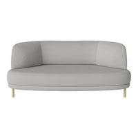 Gray curved sofa with a smooth finish and light wooden legs, featuring a minimalist design and no visible patterns.