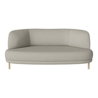 Light gray, curved sofa with a smooth texture and minimalist design, featuring natural wooden legs.