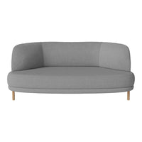Light gray curved couch with smooth fabric and wooden legs, minimalist design, perfect for modern interiors.