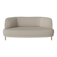 Light beige upholstered sofa with a smooth, curved design and wooden legs, showcasing a simple, modern pattern.