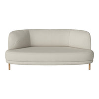 Beige curved sofa with smooth fabric and light wooden legs, perfect for modern living spaces.