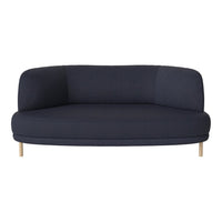 Navy blue curved sofa with a smooth fabric texture and wooden legs, perfect for modern living spaces.