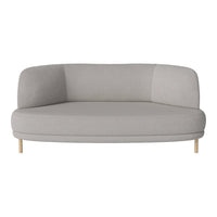 Light gray curved sofa with smooth fabric and natural wooden legs, featuring a minimalist design.