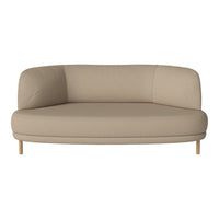 Beige curved sofa with a smooth texture and light wood legs, perfect for modern and minimalist interiors.