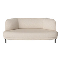 Cream-colored curved sofa with a smooth, textured fabric and sleek black metal legs. Modern and minimalist design.