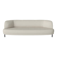 Beige curved sofa with smooth texture and minimalist design on black legs. Ideal for modern home decor.