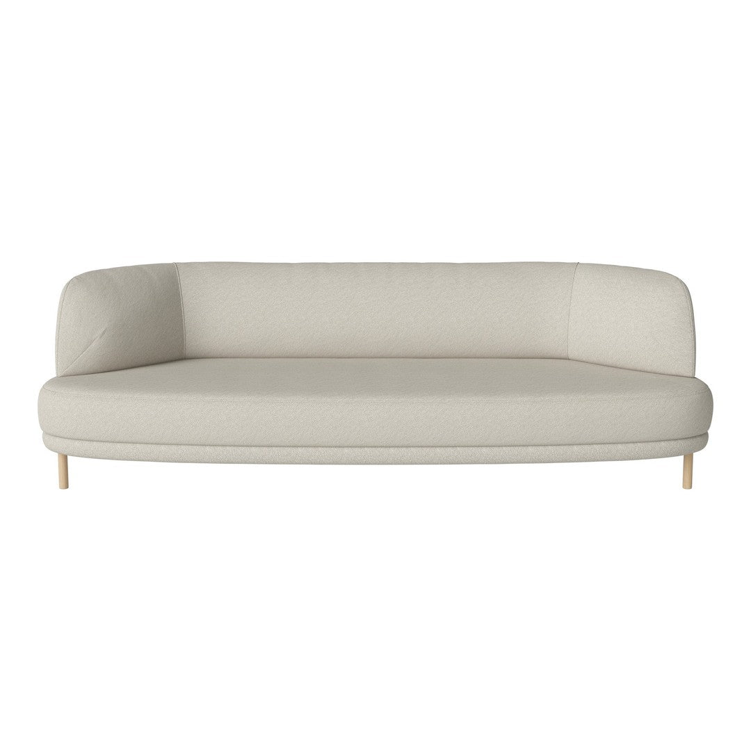Cream-colored curved sofa with a smooth texture and understated design, featuring light wooden legs.