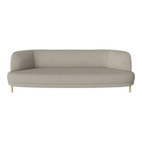 Light beige sofa with smooth, minimalist design and understated curved edges, complemented by natural wood legs.