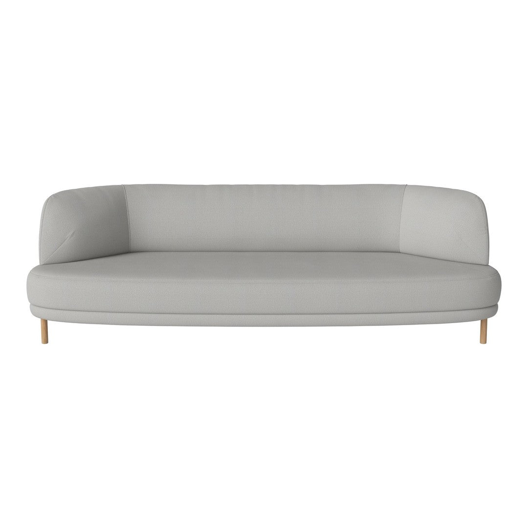 Light gray curved sofa with minimalistic design and wooden legs, featuring a solid color pattern.