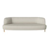 Elegant beige curved sofa with smooth fabric and light wooden legs, perfect for modern living spaces.