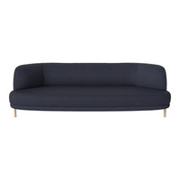 Navy blue curved sofa with a smooth fabric texture and light wooden legs, ideal for modern interior decor.