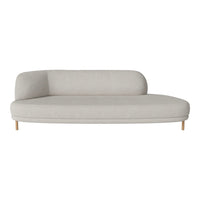 Light gray curved sofa with a minimalist design and soft texture, featuring wooden legs for a modern touch.