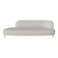 Curved beige sofa with a smooth, minimalist design, featuring soft fabric and light wood legs. Perfect for modern decor.