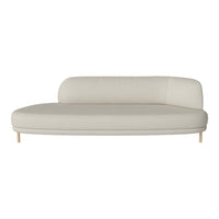 Modern beige sofa with a smooth, curved design and light wooden legs, perfect for contemporary interiors.