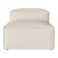 Cream-colored, minimalist chaise lounge with a smooth, solid pattern and modern design. Perfect for any decor.