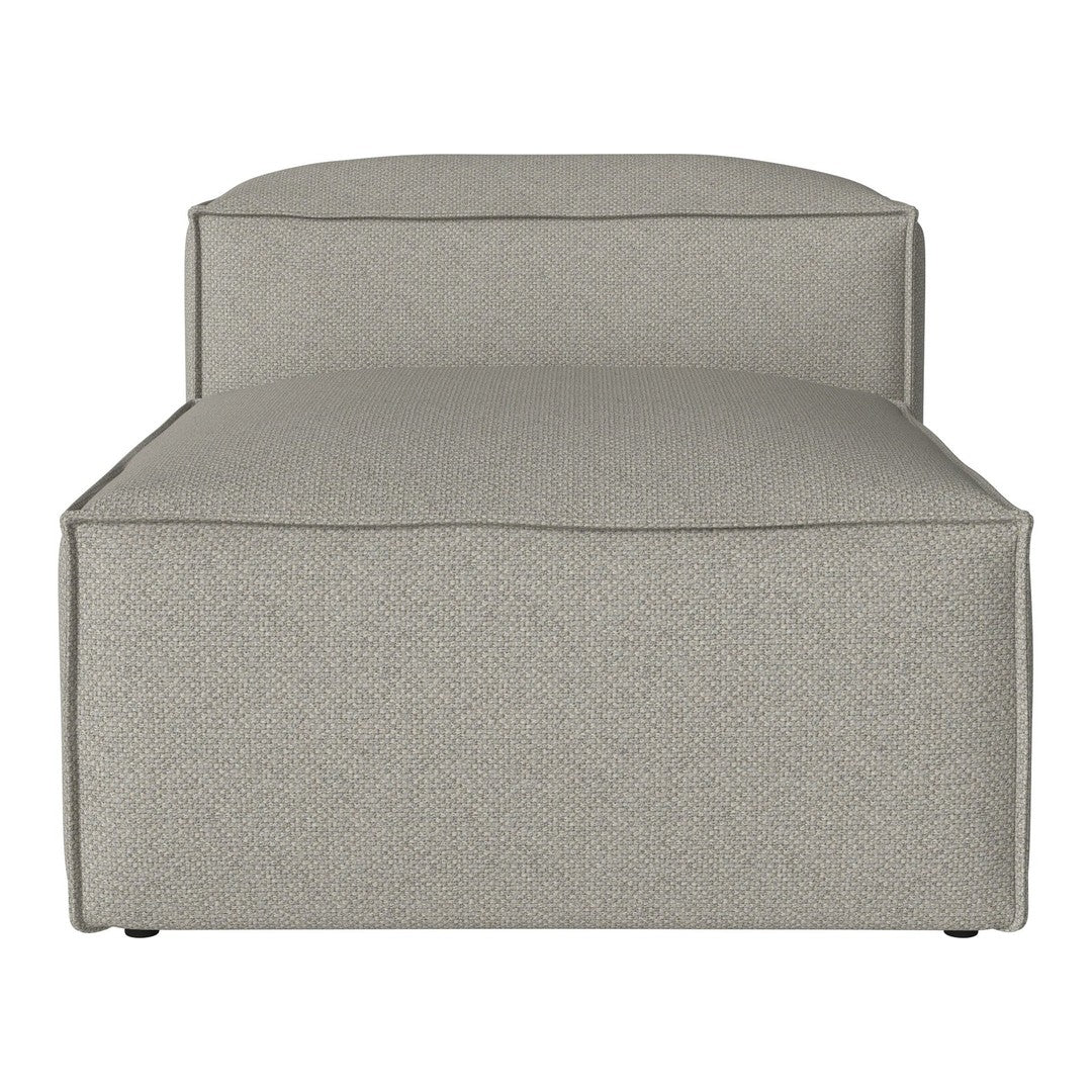 Neutral beige upholstery with a subtle textured pattern on a modern, minimalist chaise lounge.