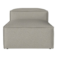 Neutral beige upholstery with a subtle textured pattern on a modern, minimalist chaise lounge.