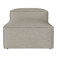 Beige upholstered chaise lounge with a smooth, minimalist design. Neutral tones for versatile decor.