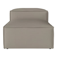 Light taupe chaise lounge with a smooth, textured fabric, featuring clean lines and a minimalist design.