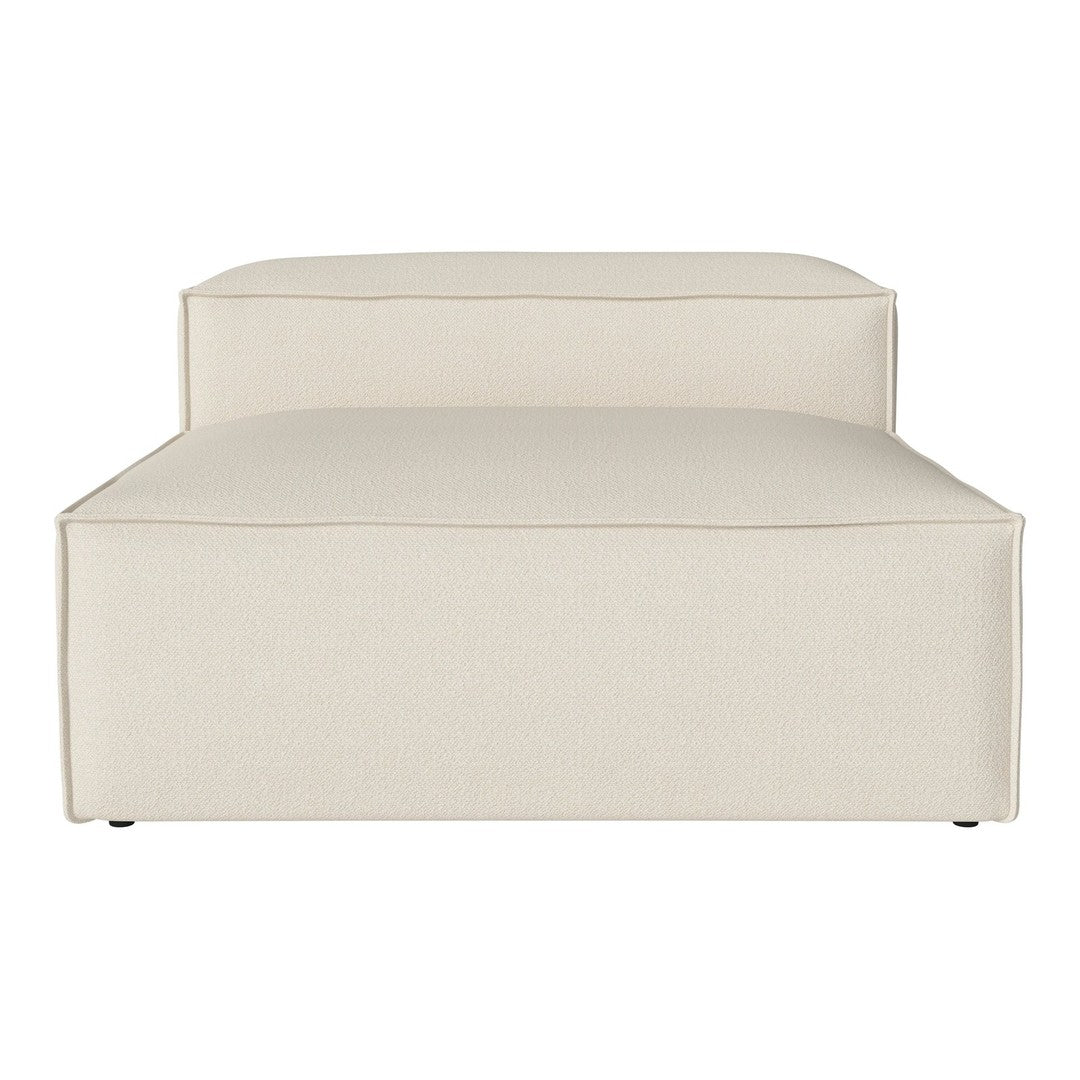 Beige upholstered chaise lounge with minimalistic design and subtle texture, perfect for modern decor.