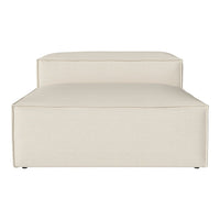 Beige upholstered chaise lounge with minimalistic design and subtle texture, perfect for modern decor.
