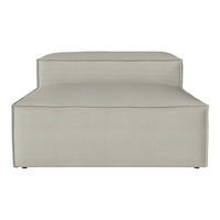 Light beige lounge chair with a textured pattern, featuring clean lines and a modern design. Perfect for any decor.