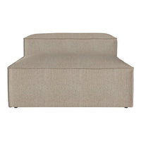 Neutral beige fabric chaise lounge with a subtle textured pattern and clean, modern lines. Ideal for contemporary spaces.