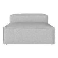 Light gray couch with smooth, modern fabric and minimalistic design, perfect for contemporary interiors.