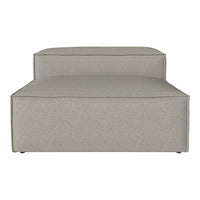 Light gray upholstered chaise lounge with a smooth, minimalist design.