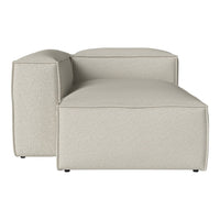 Beige upholstered modular sofa with a sleek, minimalist design and subtle texture. Ideal for modern decor.