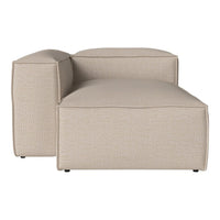 Beige sectional sofa with subtle textured pattern, featuring clean lines and a contemporary design.