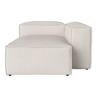 Beige modern chaise lounge with clean lines and minimalistic design, perfect for contemporary spaces.