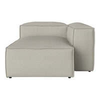 Light grey chaise lounge with a minimalist, smooth design and subtle stitching details. Ideal for modern decor.