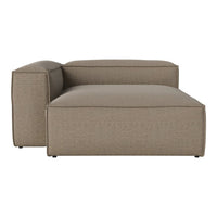 Tan upholstered chaise lounge with a textured woven pattern and smooth, modern lines. Perfect for contemporary decor.