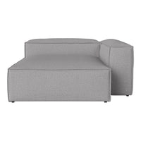 Gray modular sofa with a sleek, minimalist design and textured fabric, perfect for contemporary living spaces.