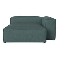 Teal modular sofa with a textured, woven fabric pattern, featuring clean lines and a modern design.
