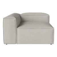 Grey upholstered sectional couch with a smooth, minimalist design and clean lines. Perfect for modern decor.