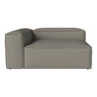 Modern gray chaise lounge with a textured fabric pattern, featuring clean lines and a minimalist design.