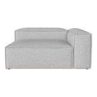 Light gray sectional sofa with a smooth texture and minimalist design, featuring straight lines and a modern look.