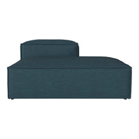 Teal upholstered chaise lounge with a sleek, modern design and subtle textured pattern. Ideal for contemporary decor.