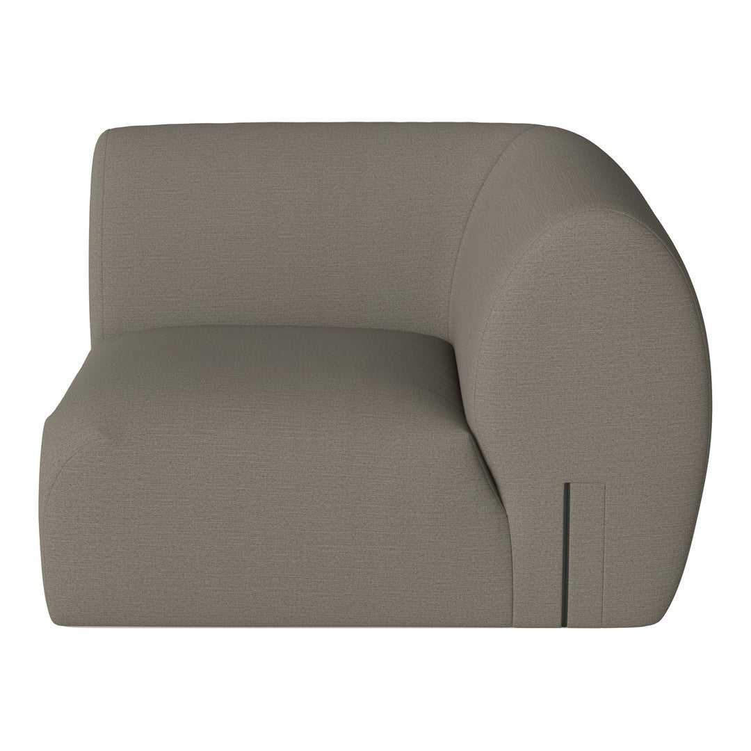 Curved accent chair in soft taupe fabric with a smooth, minimalist design. Perfect for modern decor.