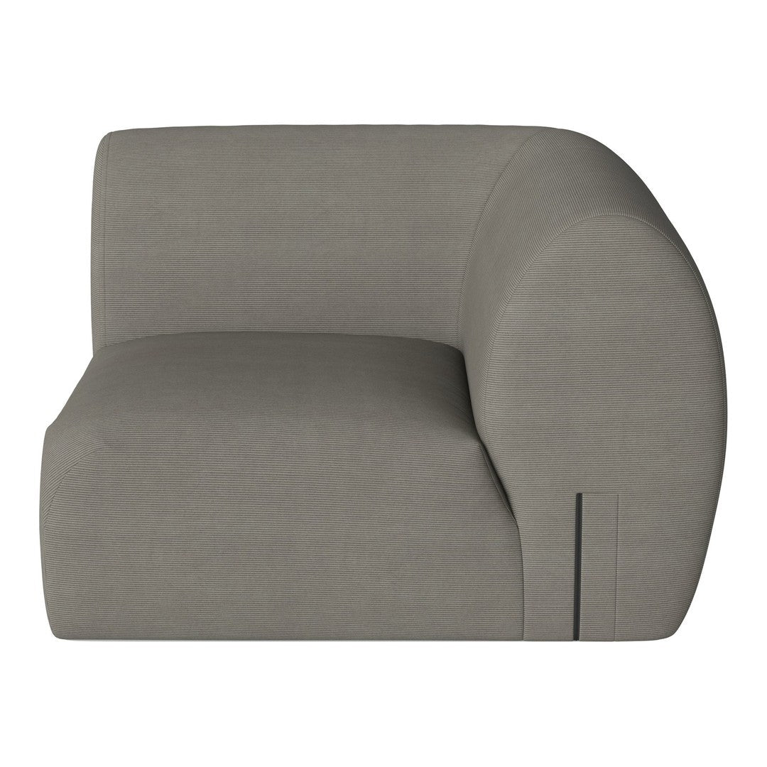 Curved modular sofa in soft gray fabric with subtle ribbed texture, perfect for modern living spaces.