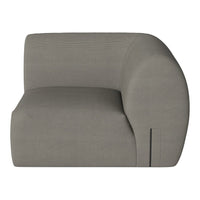 Curved modular sofa in soft gray fabric with subtle ribbed texture, perfect for modern living spaces.