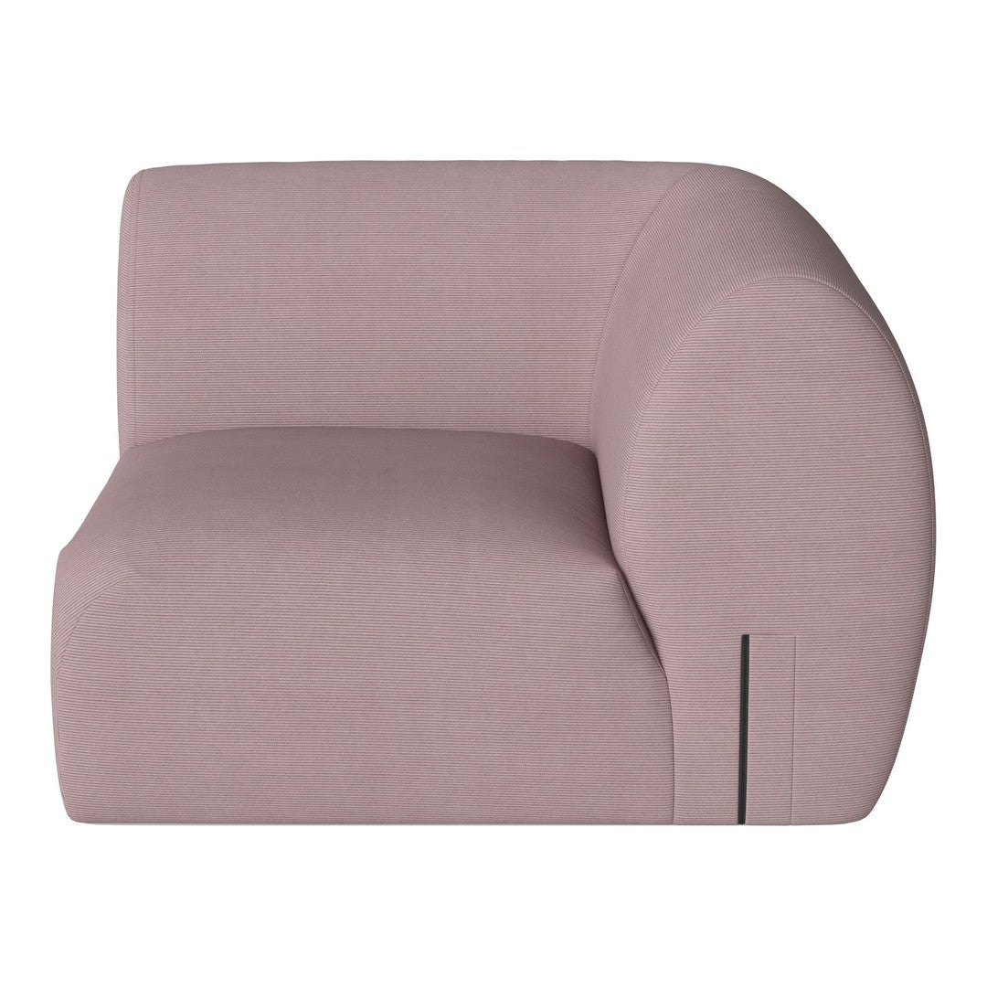 Soft pink upholstered sofa with smooth, curved lines and subtle textured pattern. Ideal for modern decor.