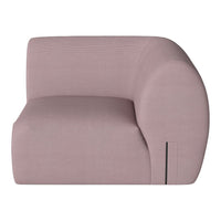 Soft pink upholstered sofa with smooth, curved lines and subtle textured pattern. Ideal for modern decor.