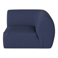 Curved navy blue upholstered chair with textured pattern, perfect for modern living spaces.