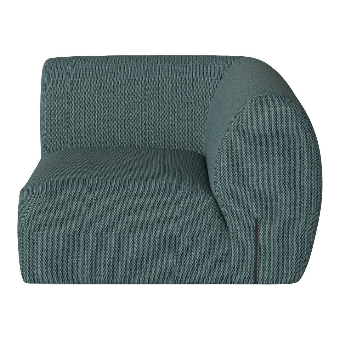 Curved teal sofa with textured fabric, featuring a subtle geometric pattern for modern decor.